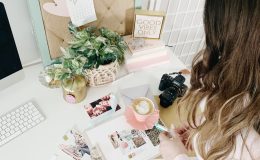 pink and white cards and photos